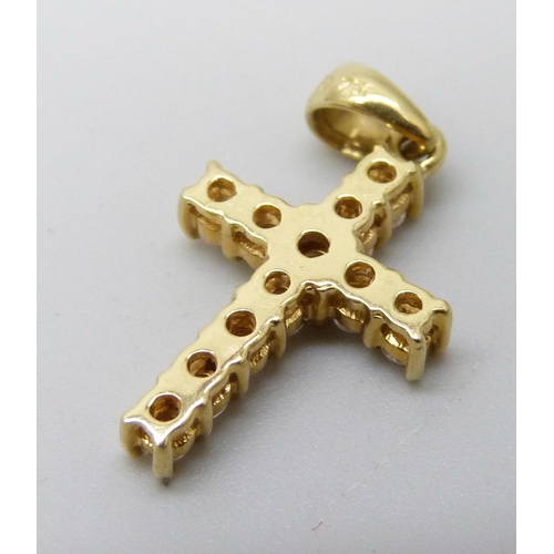 7056 - An 18ct gold and diamond set cross pendant, 1.9g, 12mm wide