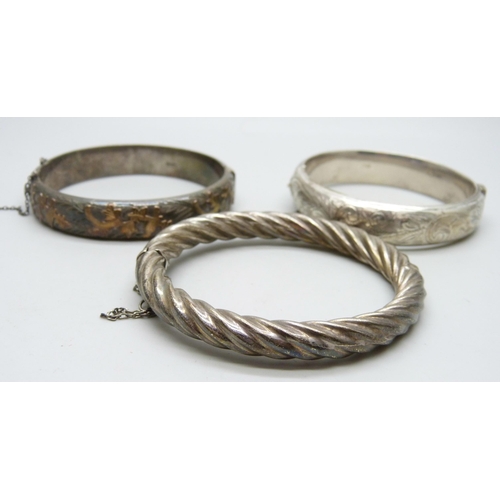 7060 - Three silver bangles, 65g