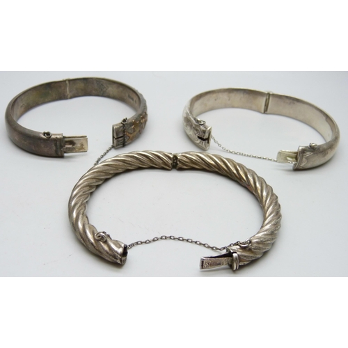 7060 - Three silver bangles, 65g