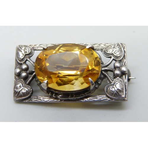 7068 - A silver and amber bangle and a silver and citrine brooch