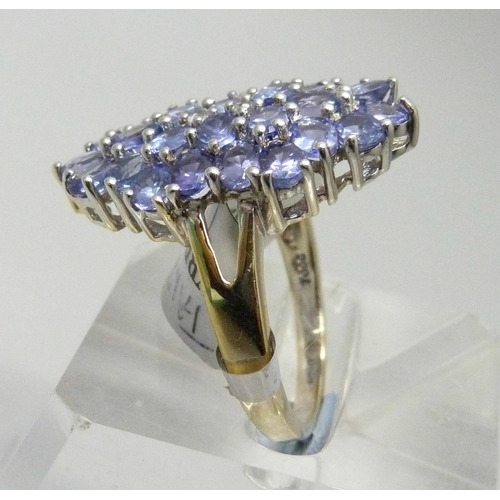 7077 - A silver gilt tanzanite and topaz cocktail ring, T/U