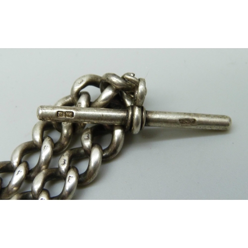 7084 - A silver double Albert chain, metal clips, 38g