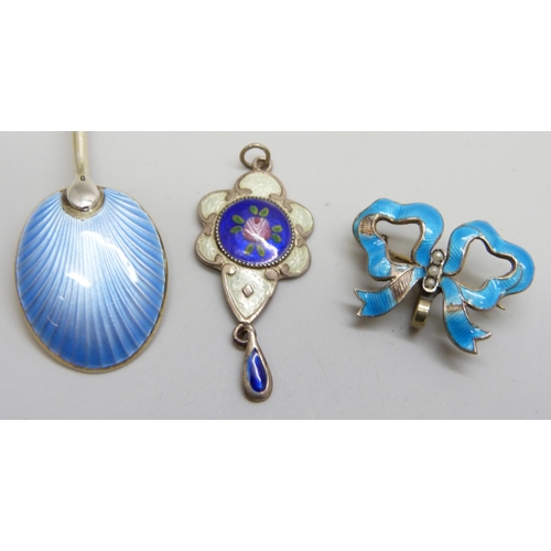 7085 - An Art Nouveau white metal and enamelled drop pendant, an enamelled bow brooch/pendant, a/f, and an ... 