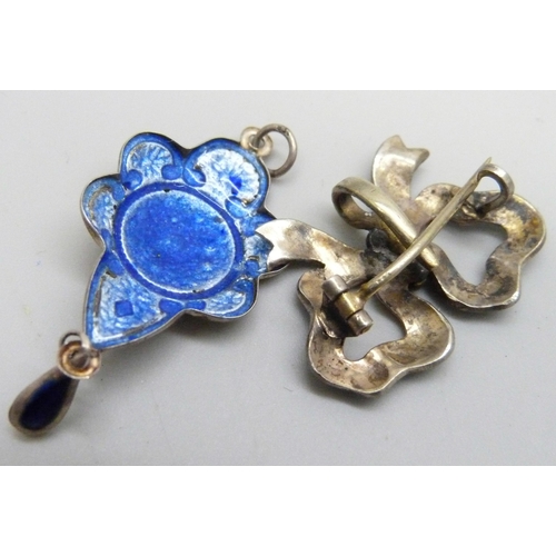 7085 - An Art Nouveau white metal and enamelled drop pendant, an enamelled bow brooch/pendant, a/f, and an ... 