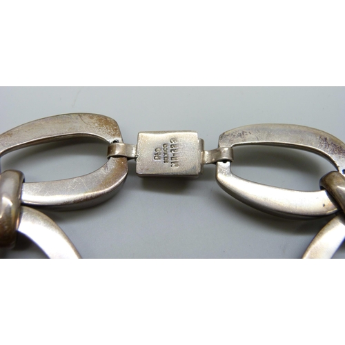 7087 - A silver bracelet marked Mexico, 78g, 21.5cm