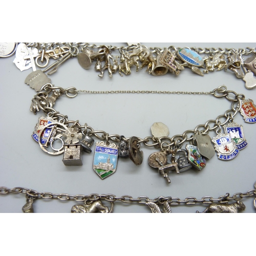 7090 - Four silver charm bracelets, 101g, two require fasteners