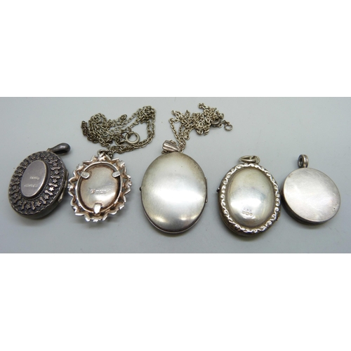 7105 - Five silver lockets including one Victorian