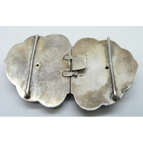 7124 - An Indian silver buckle, chased decoration