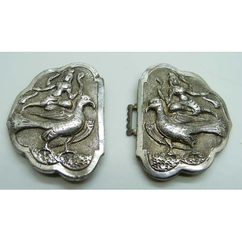 7124 - An Indian silver buckle, chased decoration