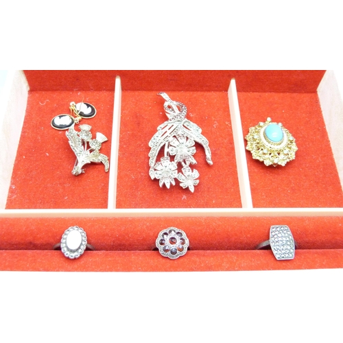 7131 - A silver, opal and marcasite ring, two other silver rings and three brooches