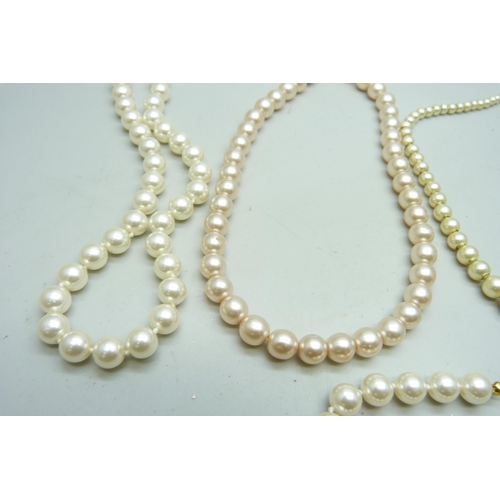 7138 - Four faux pearl necklaces and a bracelet