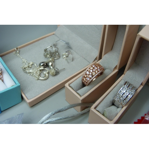 7148 - A large collection of silver rings and other silver jewellery, diamonique set, etc.