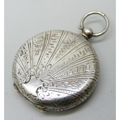 7180 - A silver fob watch and key, lacking glass