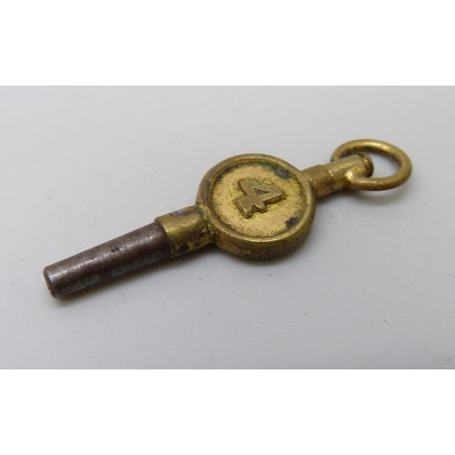 7180 - A silver fob watch and key, lacking glass