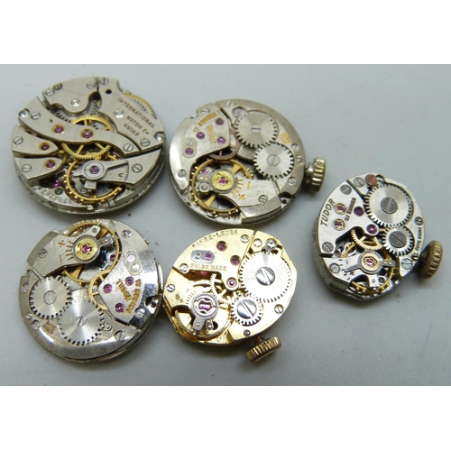 7186 - Three Tudor by Rolex wristwatch movements, one with missing dial, an International Watch Co. (IWC) m... 