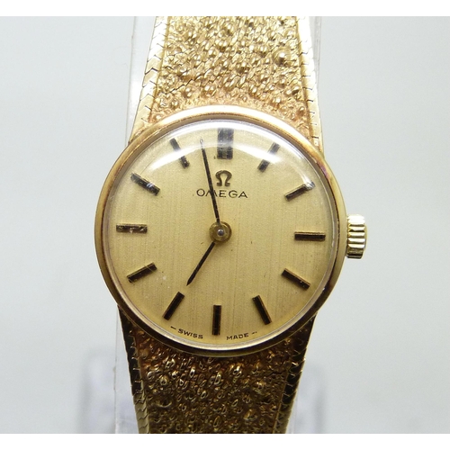 7213 - A lady's 9ct gold Omega wristwatch, with box and papers, total weight 18.6g