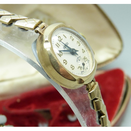 7217 - A 9ct gold lady's wristwatch, Roamer, cased