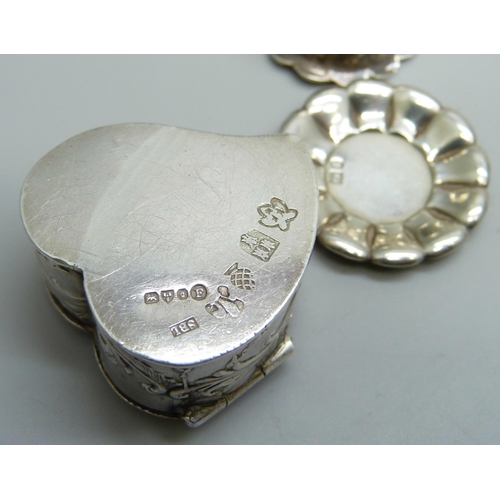 7255 - A miniature continental silver cup and saucer and a silver heart shaped pill box, both with import s... 