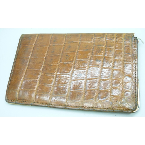 7264 - A 9ct gold mounted leather wallet, 10.5cm x 16.5cm