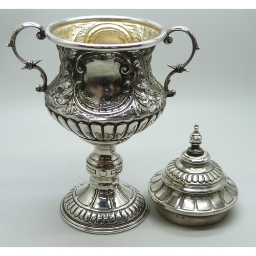 7266 - An embossed silver two handled lidded trophy, Birmingham 1932, 183g, 16.5cm