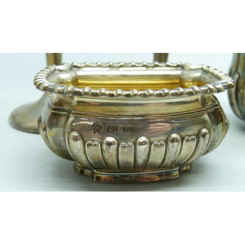 7271 - A silver cream and sugar, a silver salt and a pair of silver vases, total weight 236g, (vases a litt... 