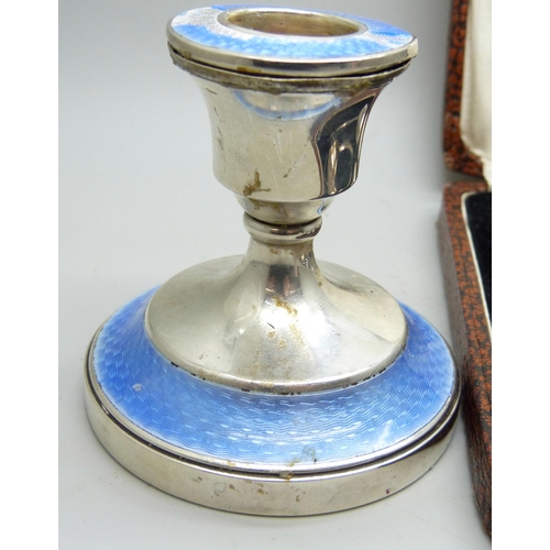 7279 - A set of six silver coffee bean spoons, 36g, and a silver candlestick with enamel, a/f