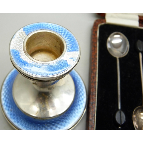 7279 - A set of six silver coffee bean spoons, 36g, and a silver candlestick with enamel, a/f