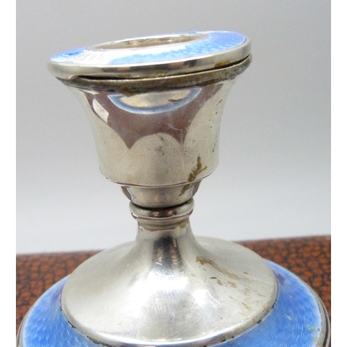 7279 - A set of six silver coffee bean spoons, 36g, and a silver candlestick with enamel, a/f