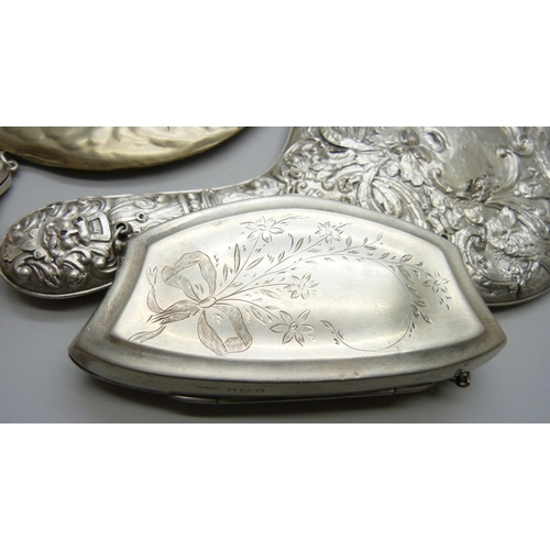 7286 - Two silver purses, 126g, a silver backed brush, a silver backed mirror, one other mirror and one oth... 