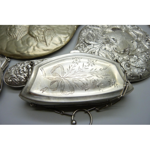 7286 - Two silver purses, 126g, a silver backed brush, a silver backed mirror, one other mirror and one oth... 