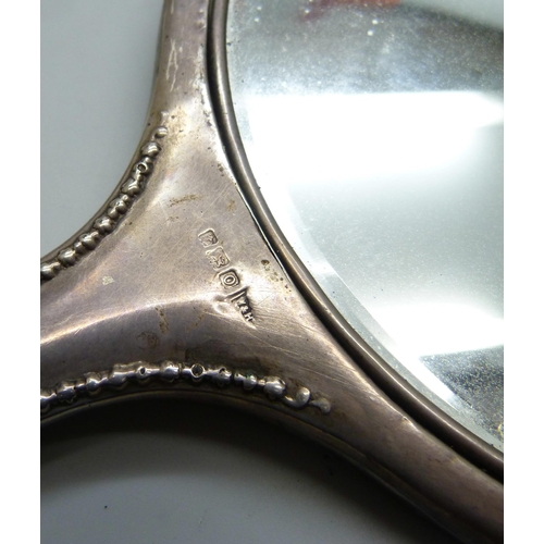 7288 - Two silver backed hand mirrors