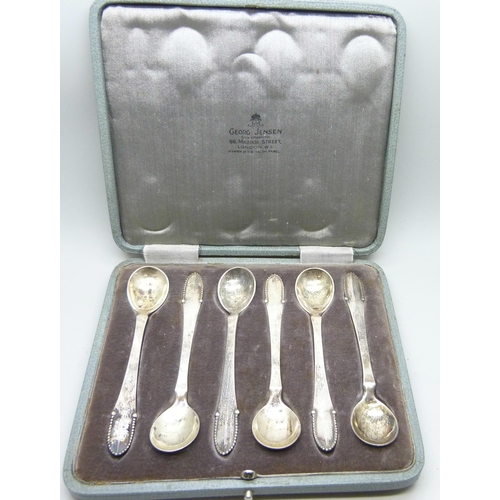 7291 - A cased set of six silver Georg Jensen spoons, with London import mark dated 1922, 70g