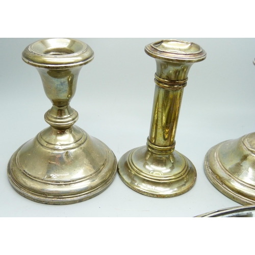 7294 - Three silver candlesticks and two silver hand mirrors