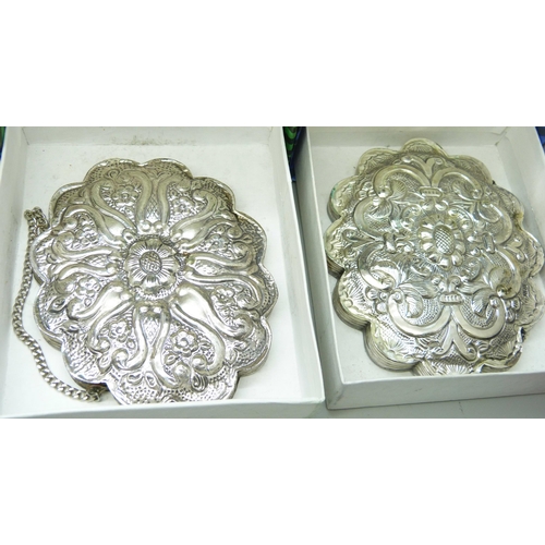 7297 - Five boxed embossed white metal wall mirrors and two others