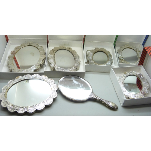 7297 - Five boxed embossed white metal wall mirrors and two others