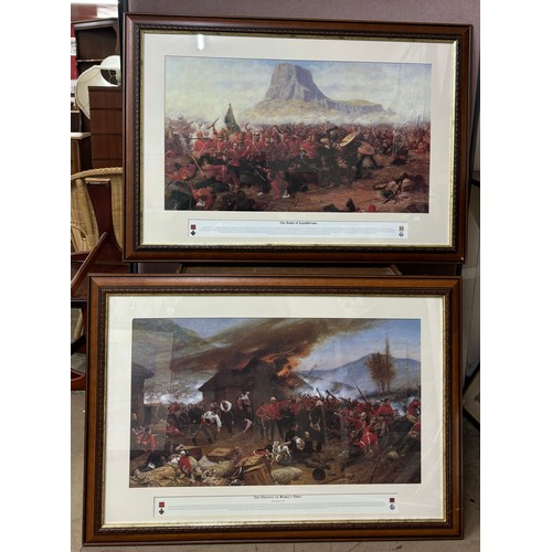 295A - Two Zulu War prints, The Defense of Rorke's Drift and The Battle of Isandhlwana, framed