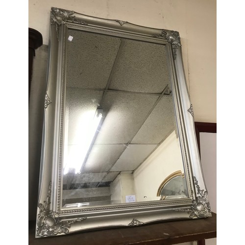 291A - A French style silver effect framed mirror