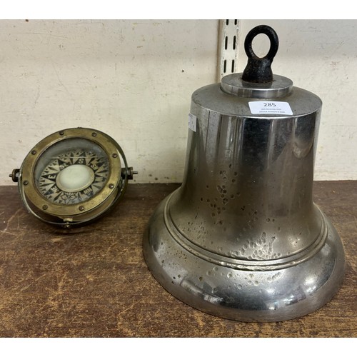 285 - A large cast metal ships bell and a nautical compass