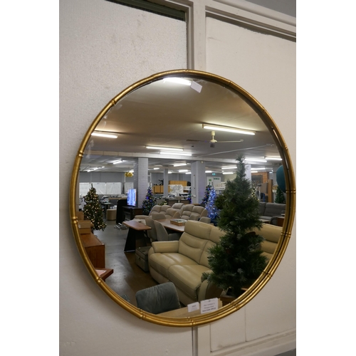 3003 - A gold painted circular bamboo effect mirror