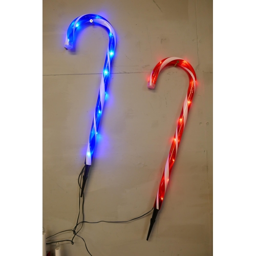 3020 - 4 Prelit Candy Canes and a Festive Candle Set