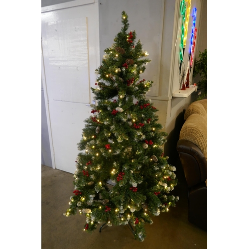 3021 - A 6ft artificial Christmas tree with festive decoration