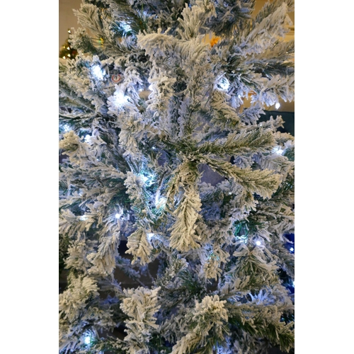 3028 - A 6ft Artificial Prelit Flocked Christmas tree