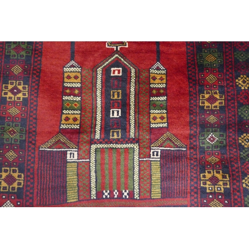 3036 - A rich red ground handwoven Afghan Baluch tribal rug