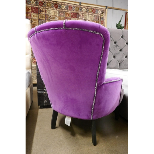 3060 - A magenta velvet upholstered shell back armchair