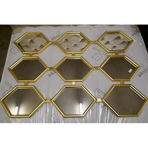 3064 - A honeycomb effect gold painted framed mirror, 120cm x 180cm