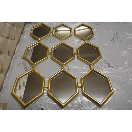 3064 - A honeycomb effect gold painted framed mirror, 120cm x 180cm