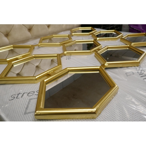 3064 - A honeycomb effect gold painted framed mirror, 120cm x 180cm