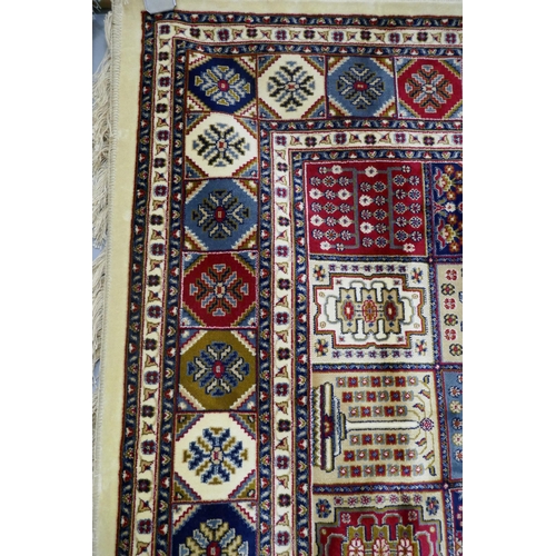 3069 - An ivory ground full pile cashmere carpet with traditional Persian pattern design