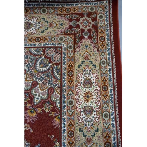 3073 - A fine woven Iranian full pile carpet with a traditional floral design, 300cm x 200cm