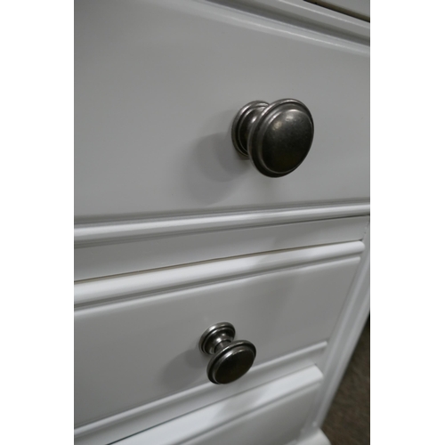 3142 - A white painted three drawer bedside chest